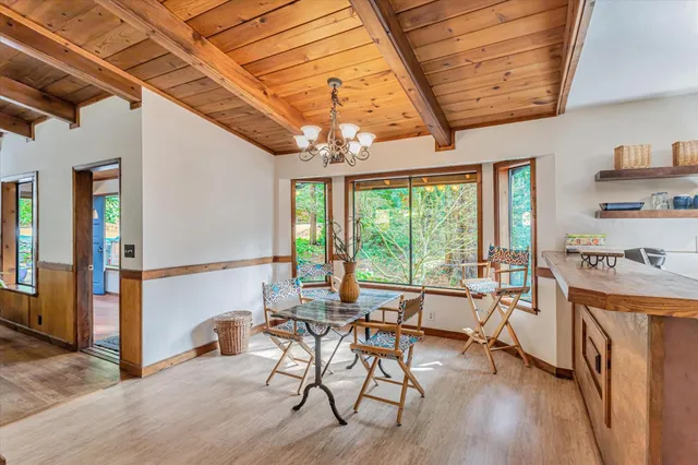 a living room with stainless steel appliances kitchen island granite countertop furniture and a kitchen view