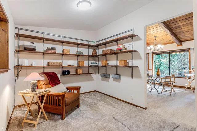 a view of a livingroom with furniture and staircase
