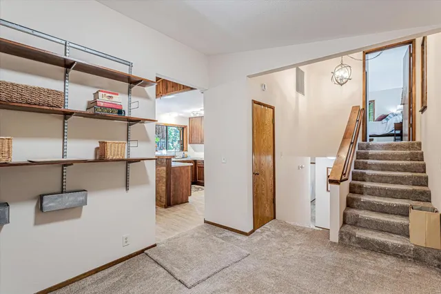 a bedroom with bed and a window