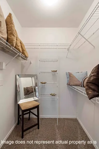 a bathroom with a sink double vanity granite and a mirror