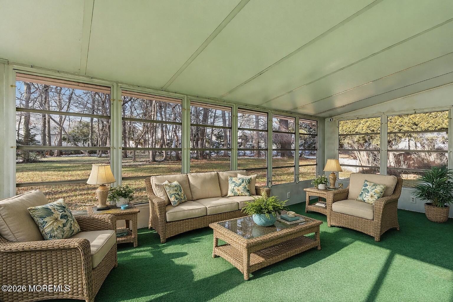 15 Encinitas Drive Toms River, NJ 08757 - Photo 27 of 45 Sunny sunroom with lush greenery
