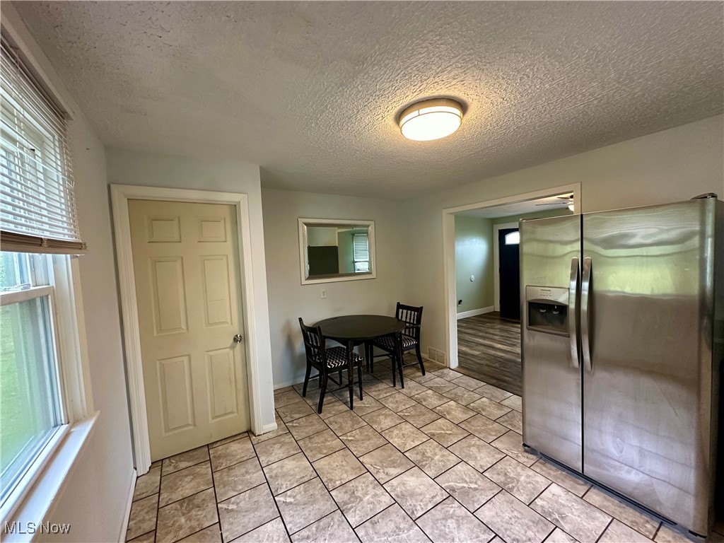 4664 Kennedy Road Lowellville, OH 44436 - Photo 3 of 11 Dining area with a textured ceiling