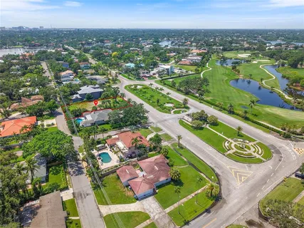 an aerial view of residential houses with outdoor space
