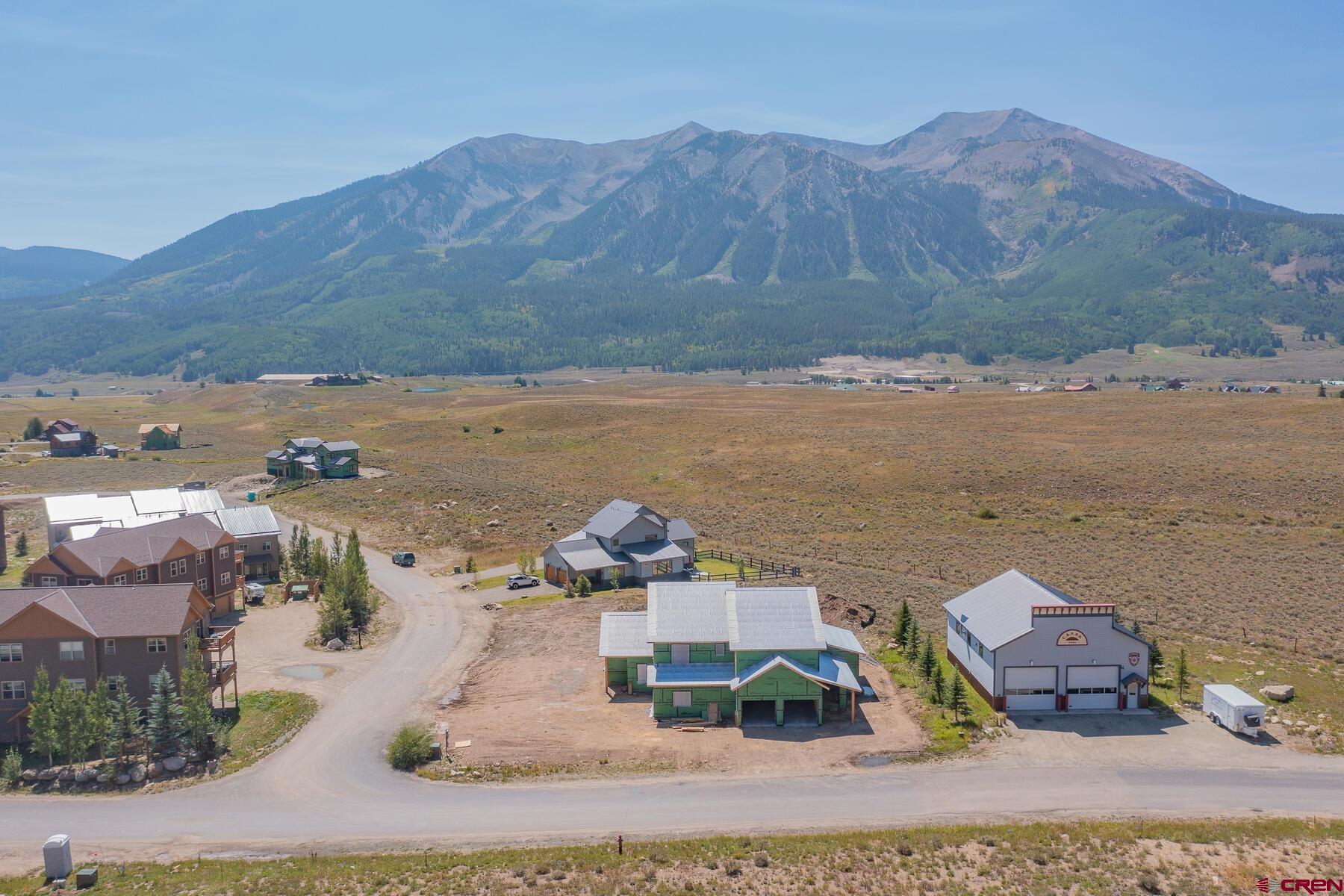 34 Elk Valley Road Crested Butte, CO 81224 - Photo 2 of 24 an aerial view of houses with a lake
