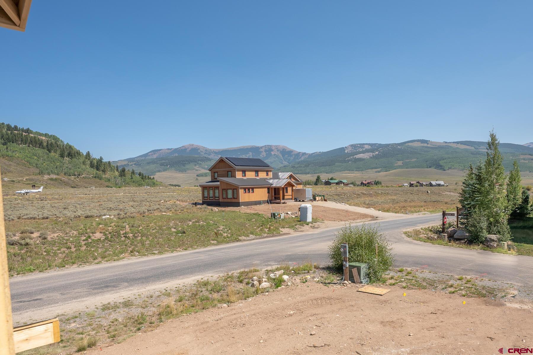 34 Elk Valley Road Crested Butte, CO 81224 - Photo 14 of 24 a view of a town with mountains in the background