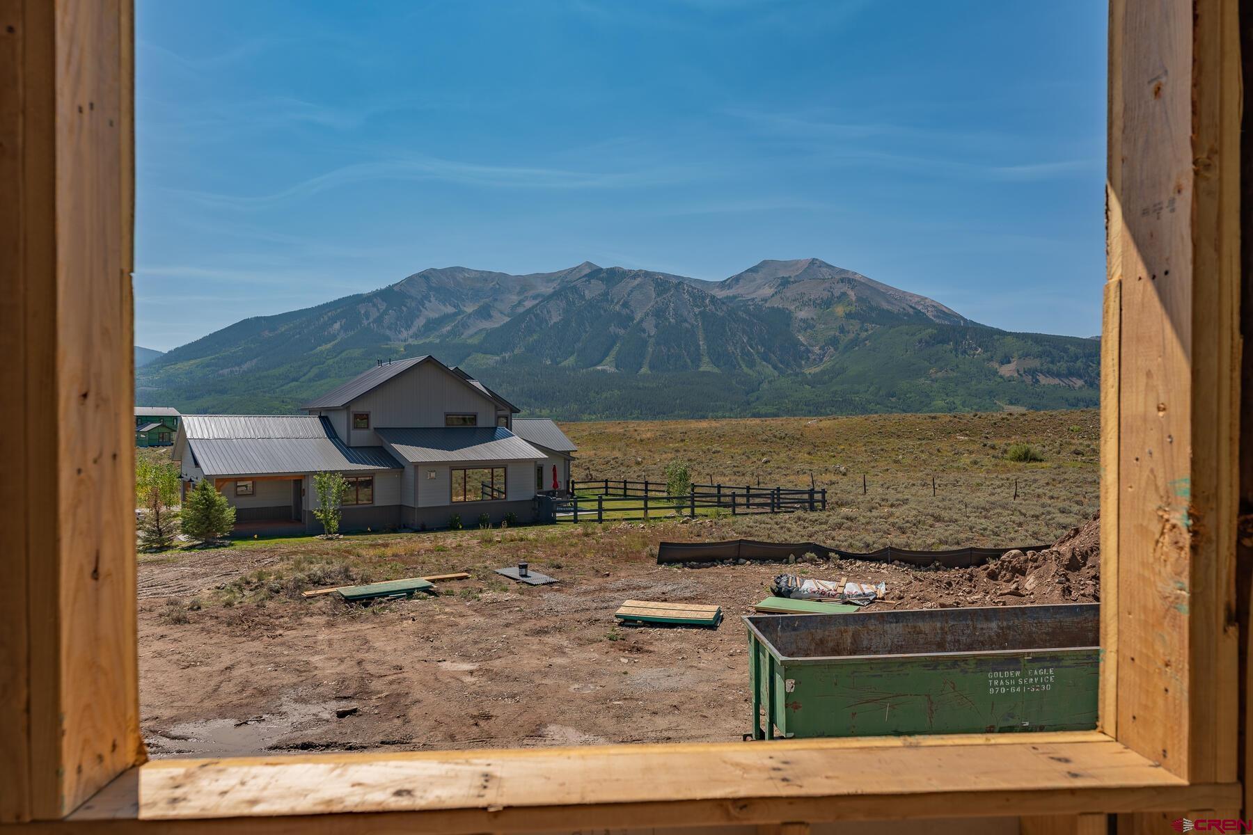 34 Elk Valley Road Crested Butte, CO 81224 - Photo 17 of 24 a view of a lake with a mountain in the background