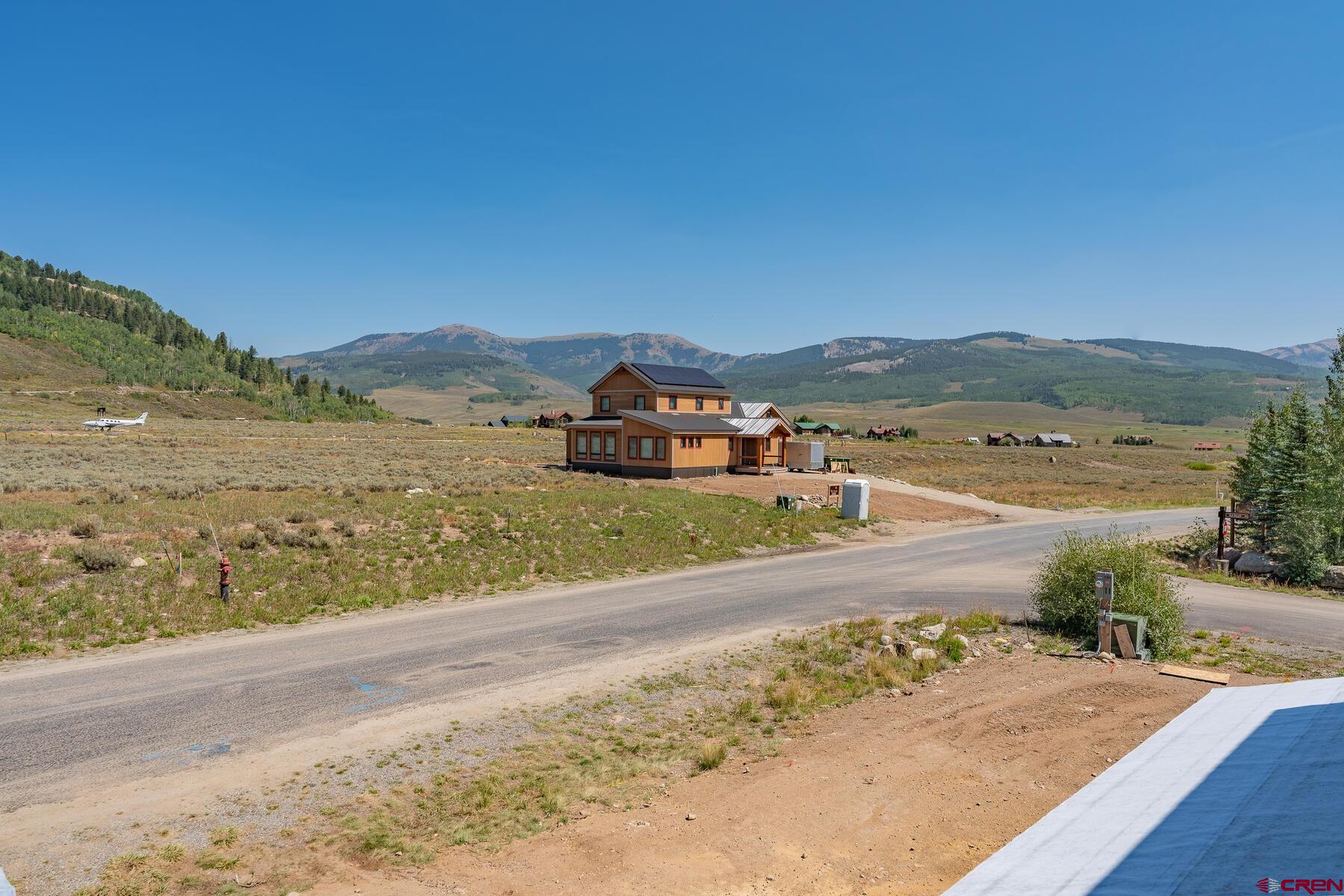 34 Elk Valley Road Crested Butte, CO 81224 - Photo 19 of 24 a view of an ocean with a mountain in the background