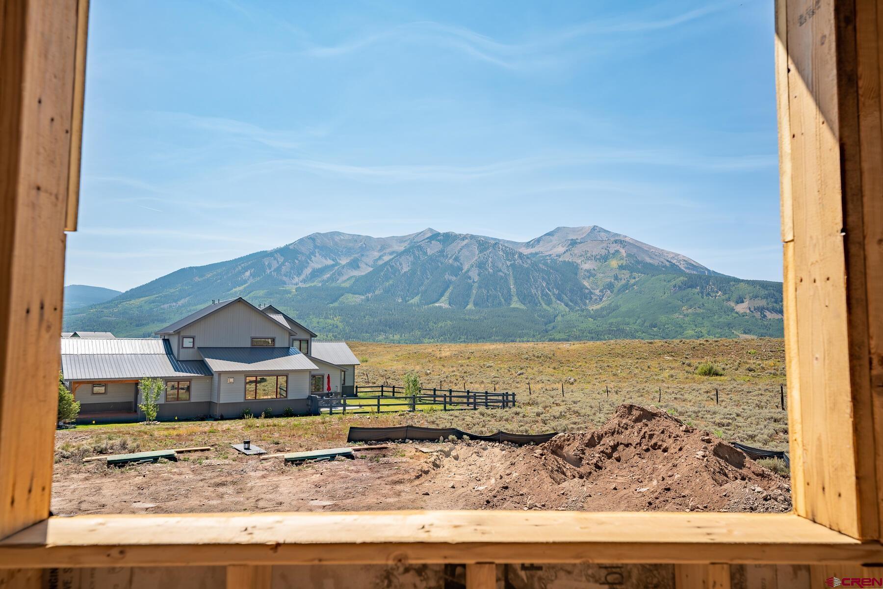 34 Elk Valley Road Crested Butte, CO 81224 - Photo 21 of 24 a view of a lake with a mountain