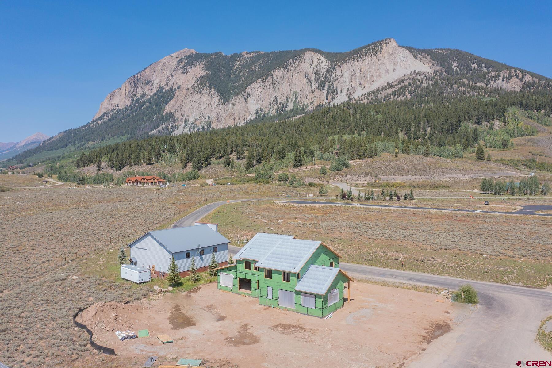 34 Elk Valley Road Crested Butte, CO 81224 - Photo 10 of 24 an aerial view of a house with a yard and mountain view