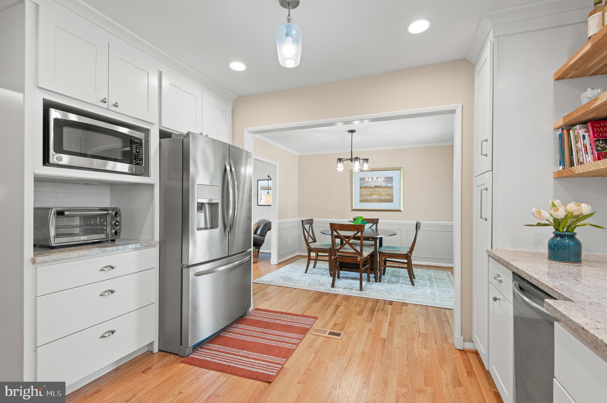 2530 Londonderry Road Lutherville-Timonium, MD 21093 - Photo 11 of 43 a kitchen with granite countertop stainless steel appliances and wooden floor