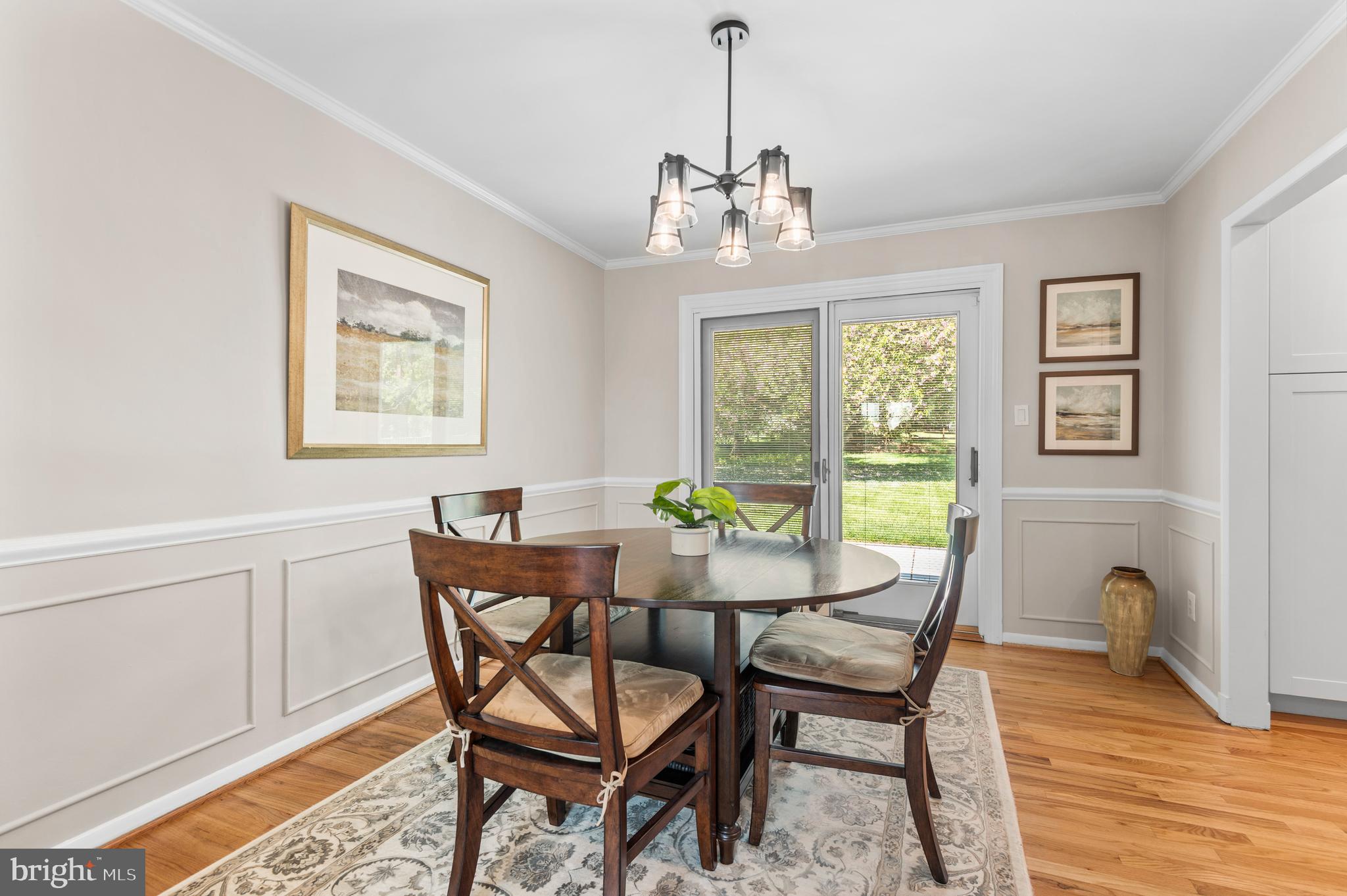 2530 Londonderry Road Lutherville-Timonium, MD 21093 - Photo 13 of 43 a view of a dining room with furniture a chandelier and wooden floor