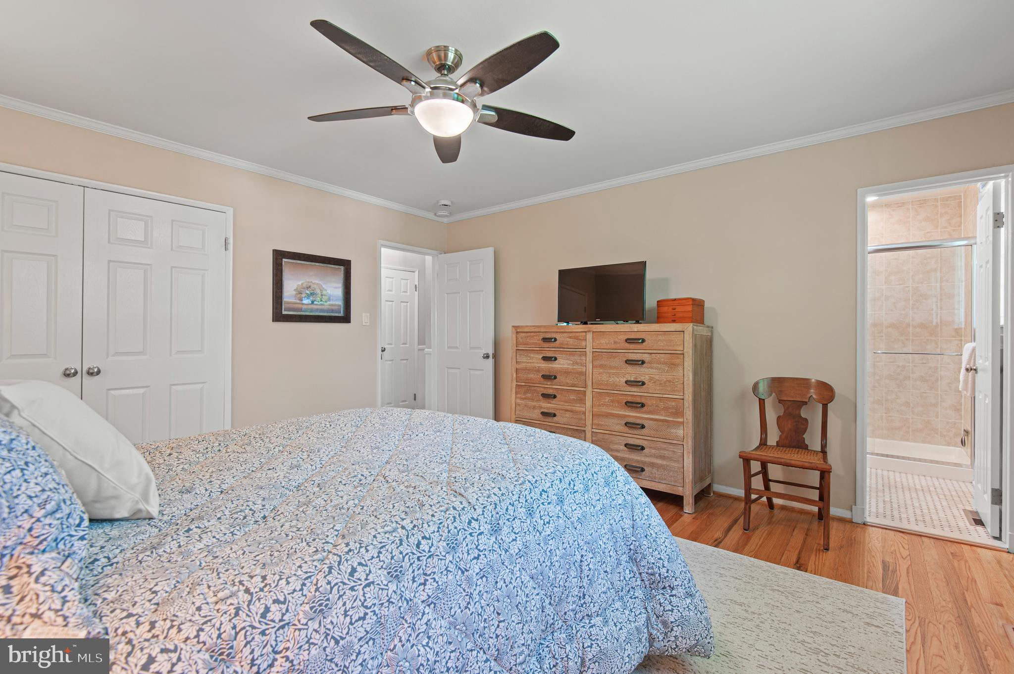 2530 Londonderry Road Lutherville-Timonium, MD 21093 - Photo 15 of 43 a bedroom with a bed a chair and a chandelier