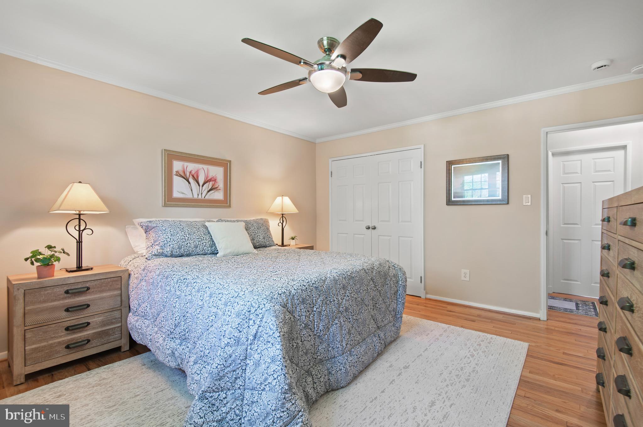 2530 Londonderry Road Lutherville-Timonium, MD 21093 - Photo 16 of 43 a bedroom with a large bed and a chandelier
