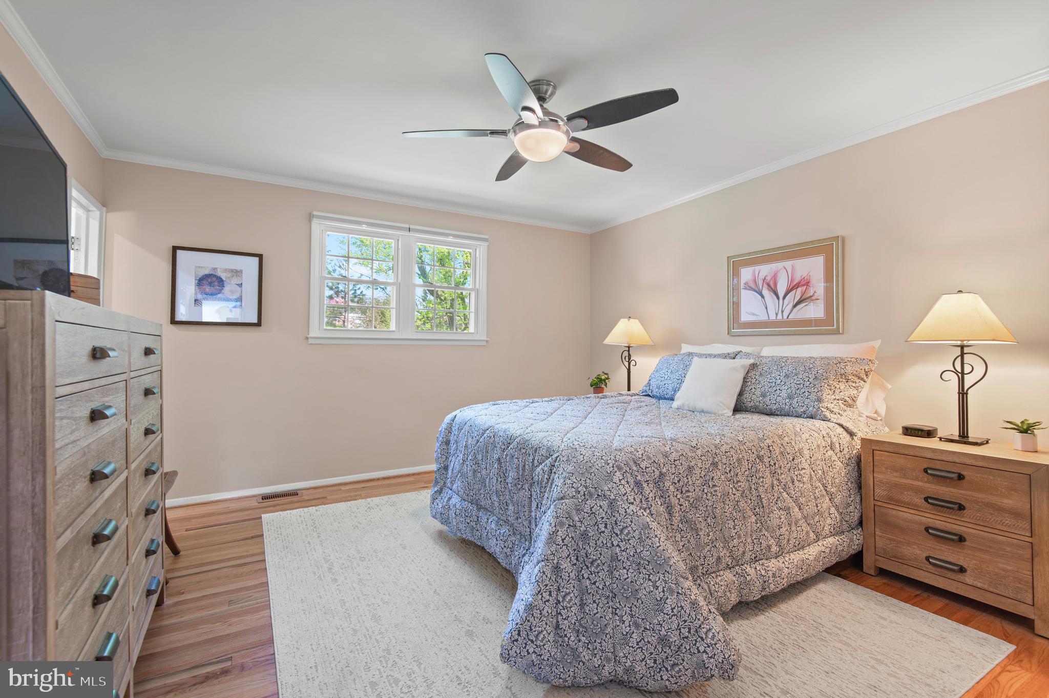 2530 Londonderry Road Lutherville-Timonium, MD 21093 - Photo 17 of 43 a bedroom with a bed and a lamp on the dresser