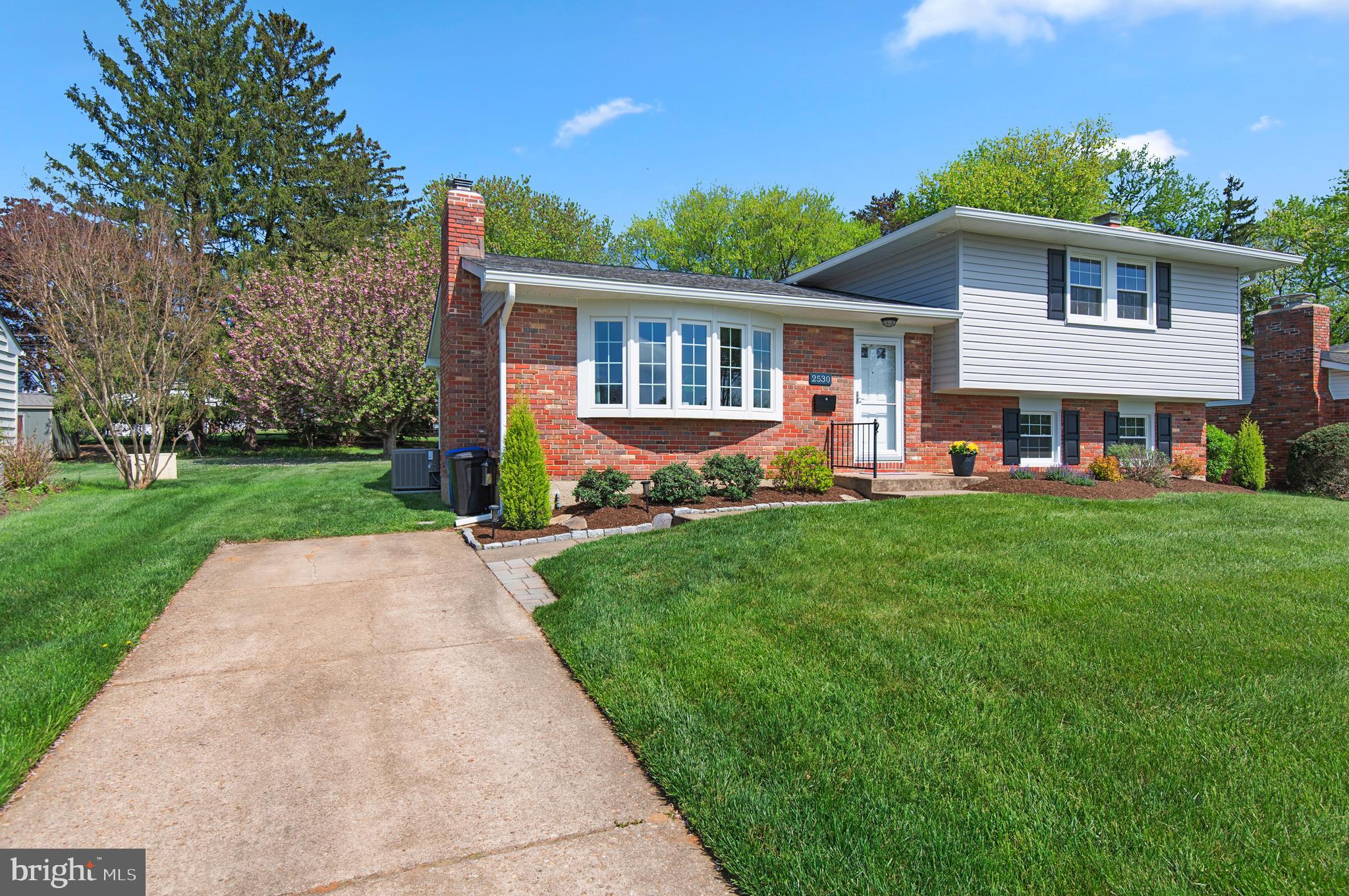 2530 Londonderry Road Lutherville-Timonium, MD 21093 - Photo 34 of 43 a front view of a house with a yard and trees