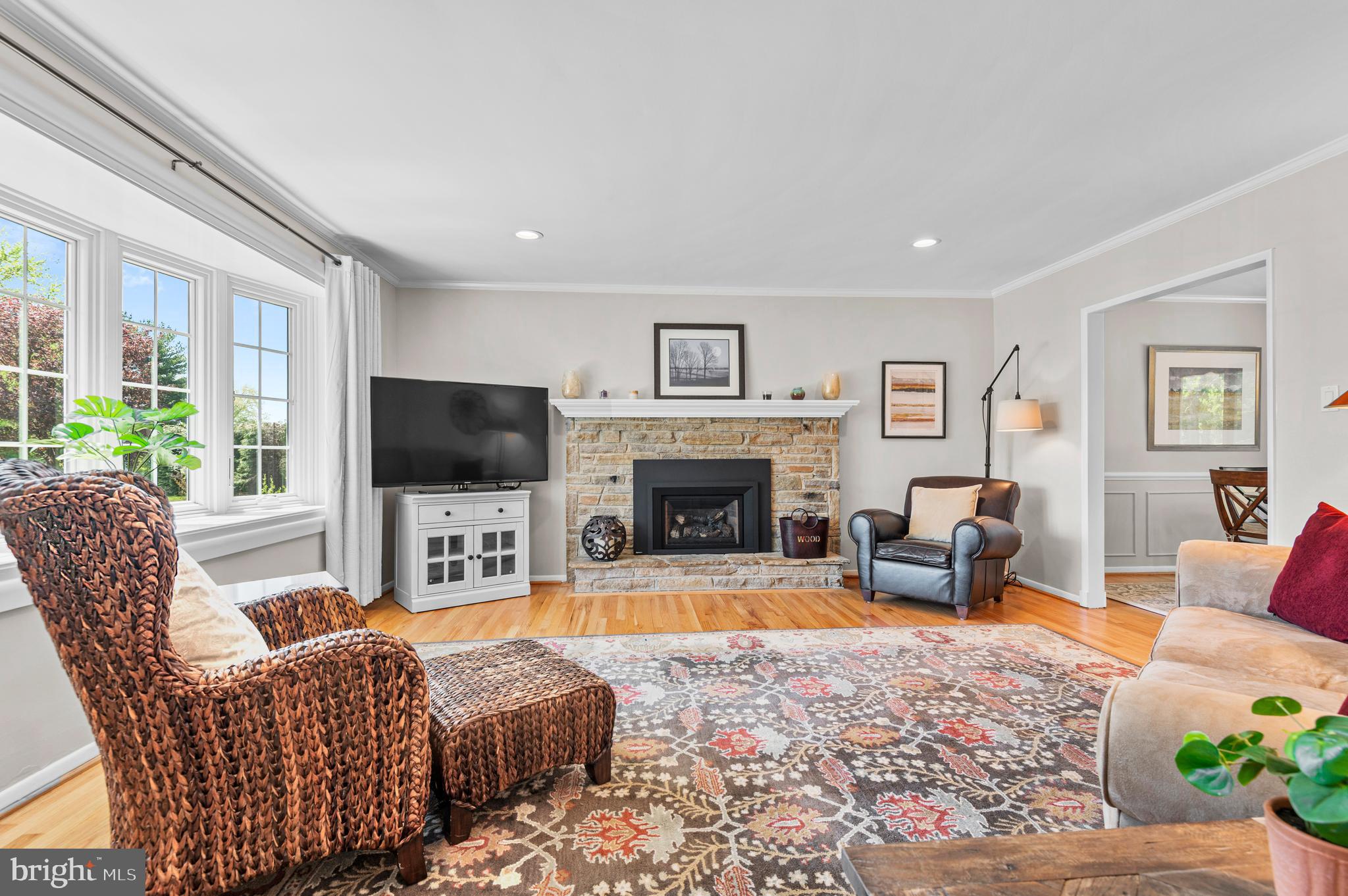 2530 Londonderry Road Lutherville-Timonium, MD 21093 - Photo 6 of 43 a living room with furniture a flat screen tv and a fireplace