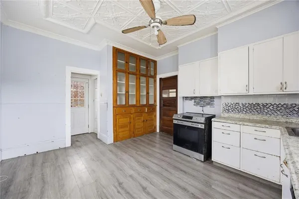 a kitchen with stainless steel appliances granite countertop a stove and a sink