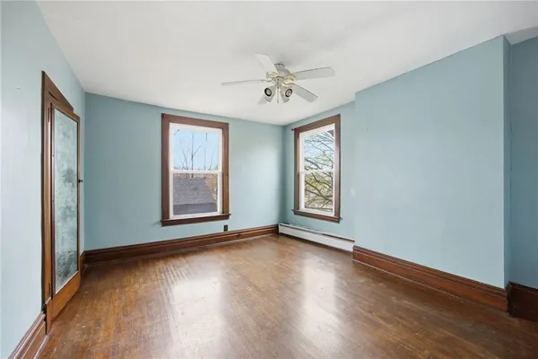 a view of livingroom with window hardwood floor and ceiling fan