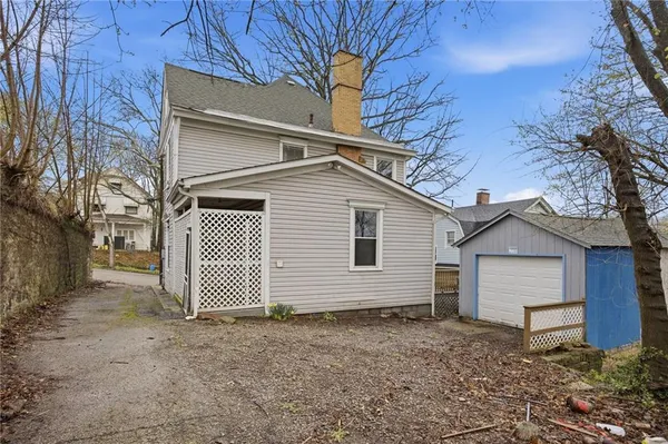a view of a house with a backyard
