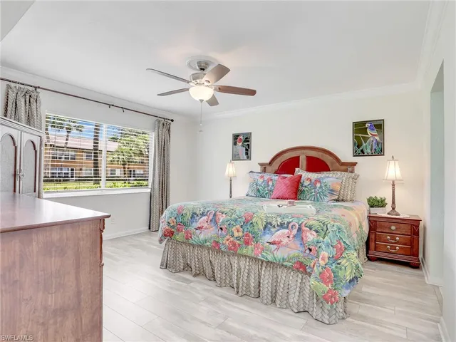 a bathroom with a sink a toilet a mirror and shower