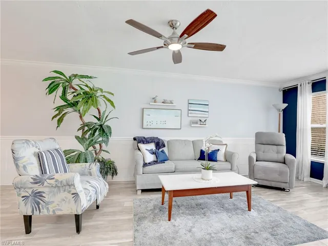 a kitchen with stainless steel appliances white cabinets and a refrigerator