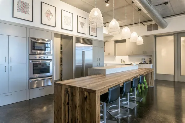 an open kitchen with a table and chairs