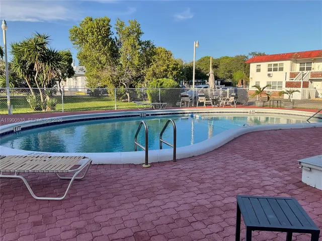 a room with furniture a washer and dryer