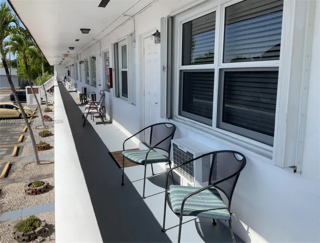 a view of a livingroom with furniture and staircase