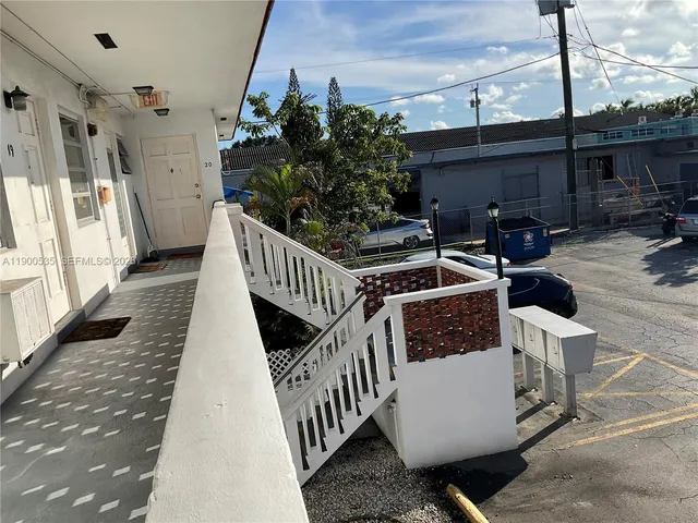 a view of balcony with furniture