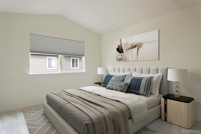 a bedroom with bed and window