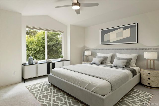 a bedroom with a large bed and a window