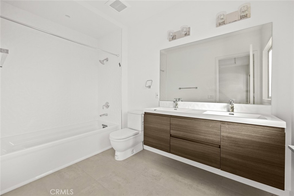 1228 Temple City Boulevard Arcadia, CA 91007 - Photo 11 of 23 a bathroom with a double vanity sink mirror and toilet
