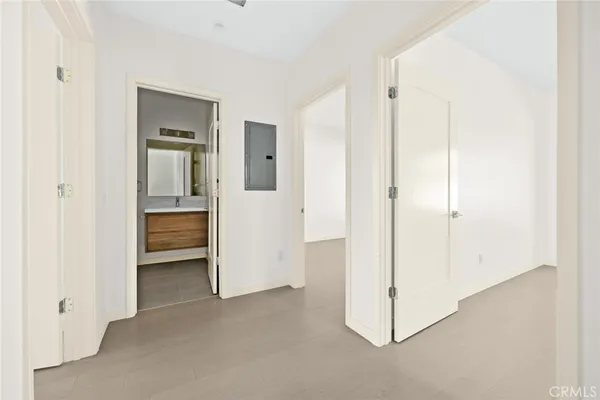 a bathroom with a double vanity sink mirror and toilet