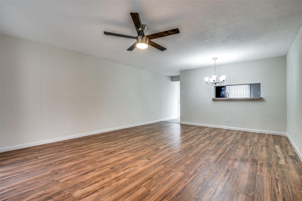 4535 North O'Connor Road, Unit 1218 Irving, TX 75062 - Photo 6 of 12 wooden floor in an empty room with a window