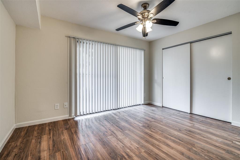 4535 North O'Connor Road, Unit 1218 Irving, TX 75062 - Photo 10 of 12 wooden floor in an empty room with a window