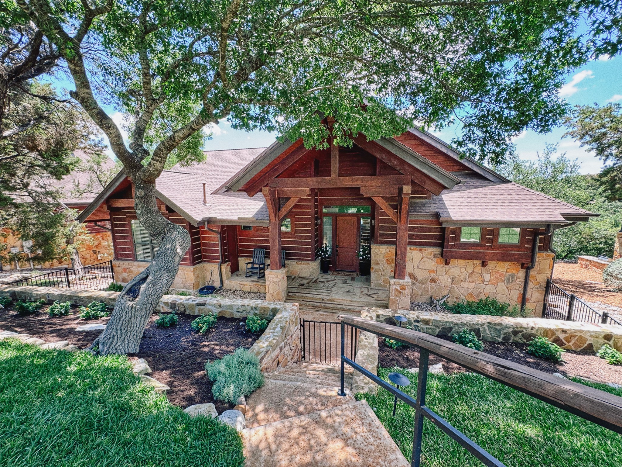 a front view of house with green space