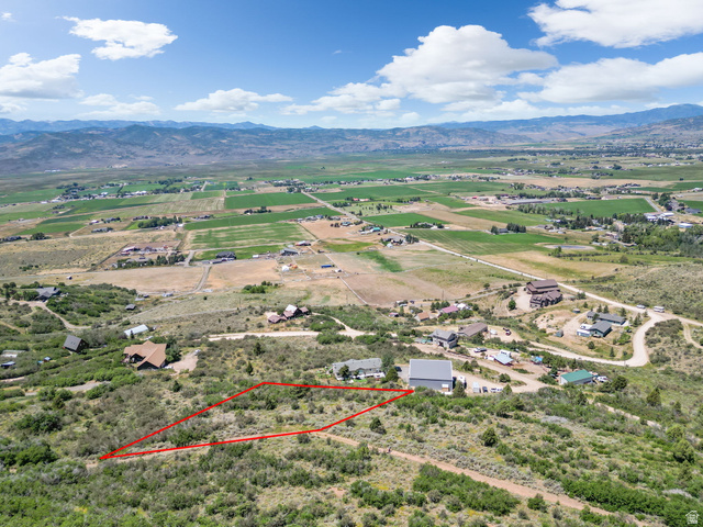 2427 Painter Road Marion, UT 84036 - Photo 1 of 1 Expansive undeveloped parcel outlined in red, featuring natural vegetation and an elevated position
