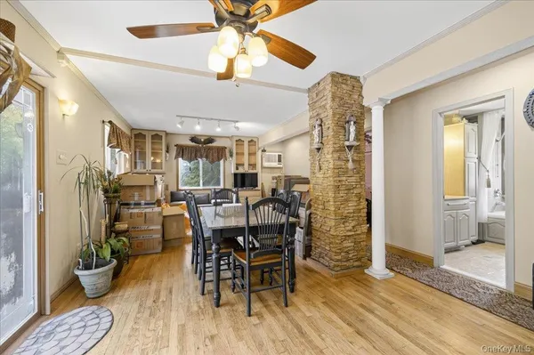 a living room with lots of furniture and chandelier