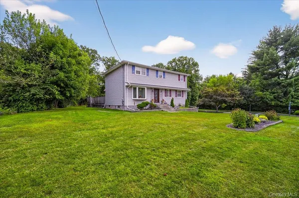a view of a house with a backyard porch and sitting area