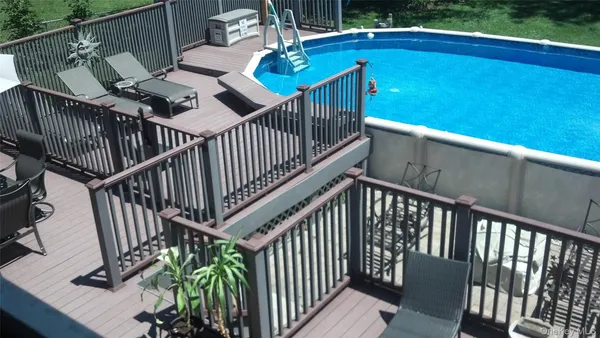 a view of deck and deck with wooden floor and fence