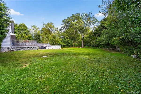 a view of a wooden deck and a patio