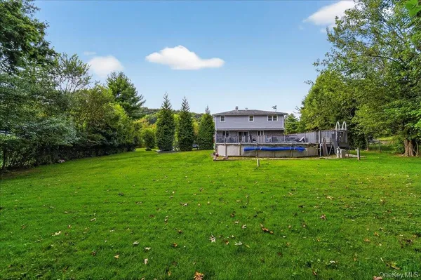 a view of a backyard with a garden and trees