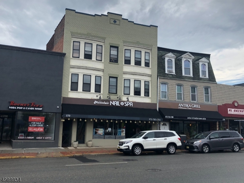 a view of a car parked in front of a building