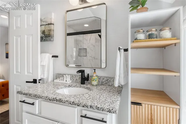 a bathroom with sink and mirror