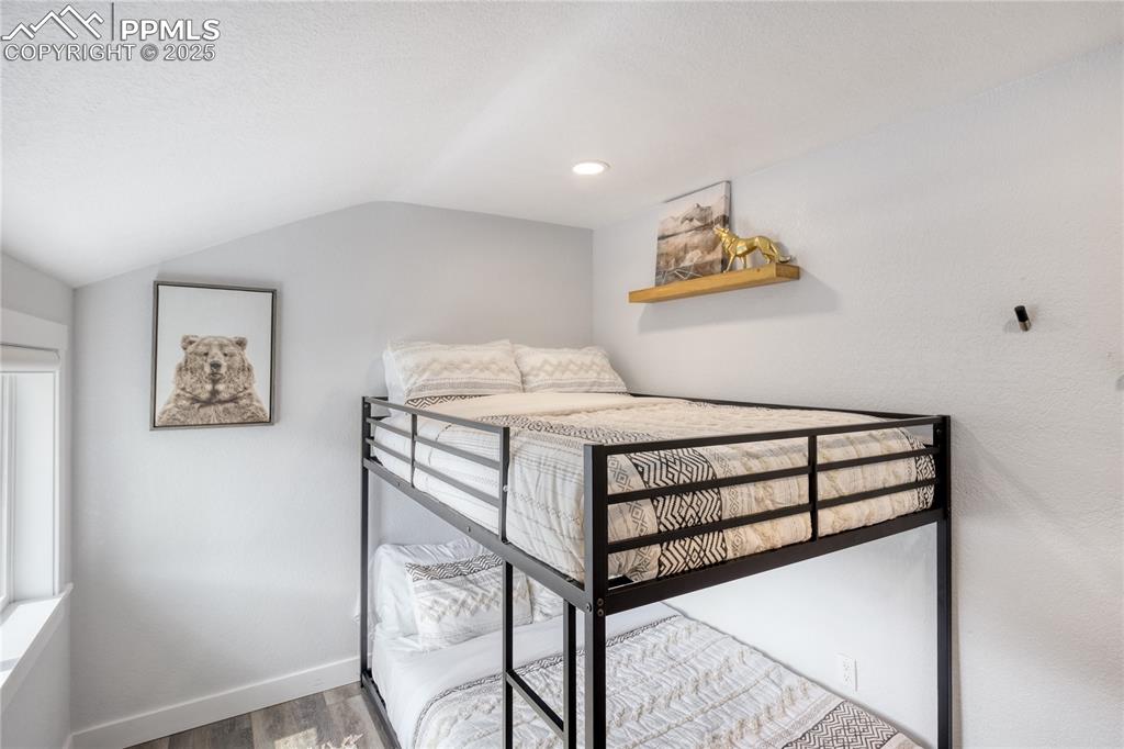 7101 Highway 50 Salida, CO 81201 - Photo 27 of 50 a bedroom with a bed and painting on the wall