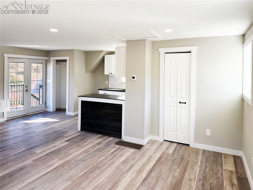 7101 Highway 50 Salida, CO 81201 - Photo 31 of 50 an empty room with wooden floor windows and cabinet