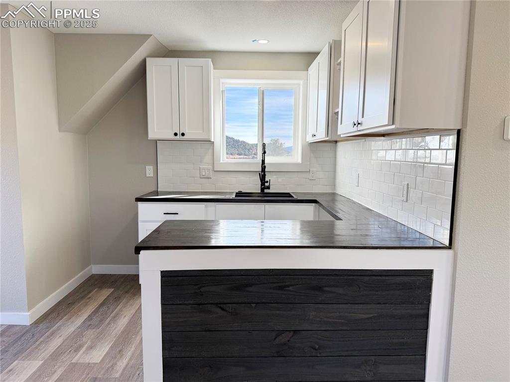7101 Highway 50 Salida, CO 81201 - Photo 34 of 50 a kitchen with cabinets appliances and a sink