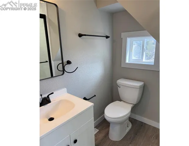 a bathroom with a toilet and a sink