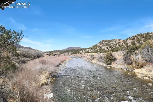 a view of a town with mountains in the background