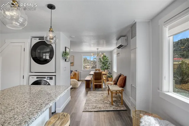 a living room with furniture and a rug